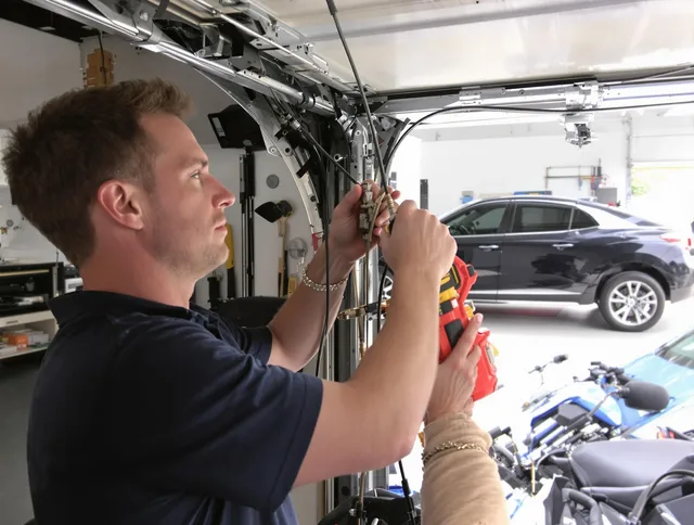 Wesley Chapel Garage Door Repair safety certified technician performing cable replacement in Wesley Chapel