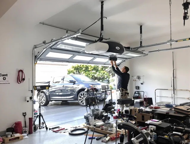 Wesley Chapel Garage Door Repair specialist installing smart garage door opener system in Wesley Chapel home